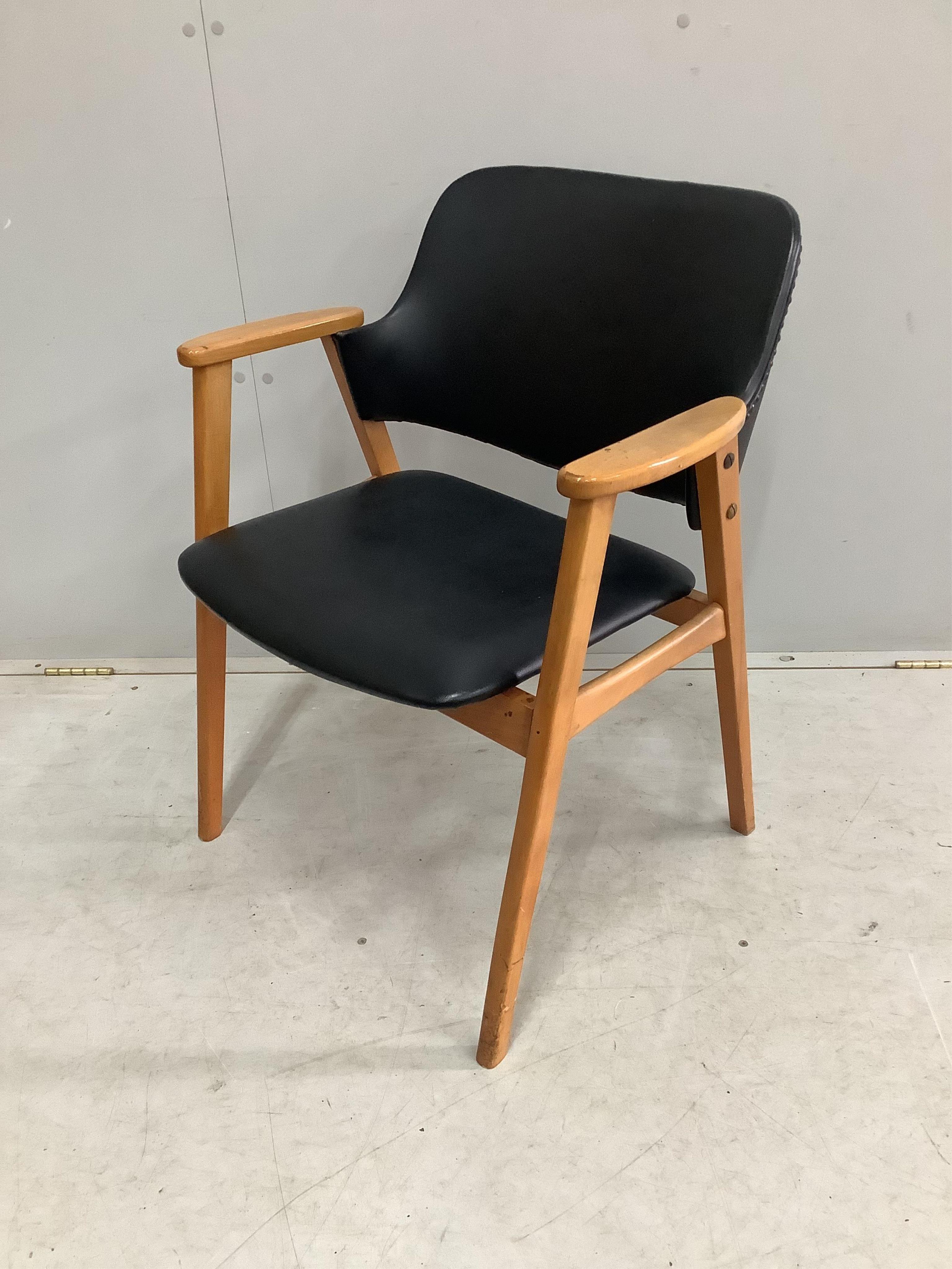 A mid century Danish Teak and Leather arm chair by Erik Kirkegaard for Glostrup, width 61cm, depth 43cm, height 75cm. Condition - fair to good